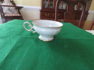 Vintage Hutschenreuther Selb Footed Cup Brighton pattern Cup 4” diameter & 2 ¼” tall White body , gold gilt accents. Made in Bavaria, Germany. Fine condition , no chips . Gold trim is beautiful. Stamp was used 1939-1965. On the bottom the name “kristina” in gold script. 1