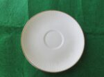 White Saucer with Gold Ring 6 inch diameter. Stamp on back in gold reads Noritake Fine China Japan. Excellent cndition. No chips, cracks, scartches. Must be considered as used. 1