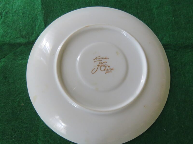 White Saucer with Gold Ring 6 inch diameter. Stamp on back in gold reads Noritake Fine China Japan. Excellent cndition. No chips, cracks, scartches. Must be considered as used. 2