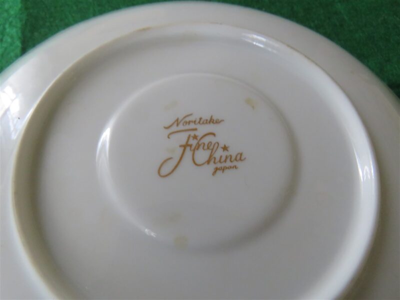 White Saucer with Gold Ring 6 inch diameter. Stamp on back in gold reads Noritake Fine China Japan. Excellent cndition. No chips, cracks, scartches. Must be considered as used. 3