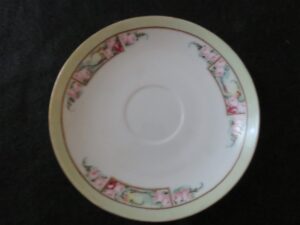 Saucer Royal Rudolstadt Prussia Signed by Mary Linderenburger Floral pattern. Green band on rim. Gold rings. 6 inch diameter. Very good condition. No chips or dings. These are vintage pieces and must be considered as used. 1