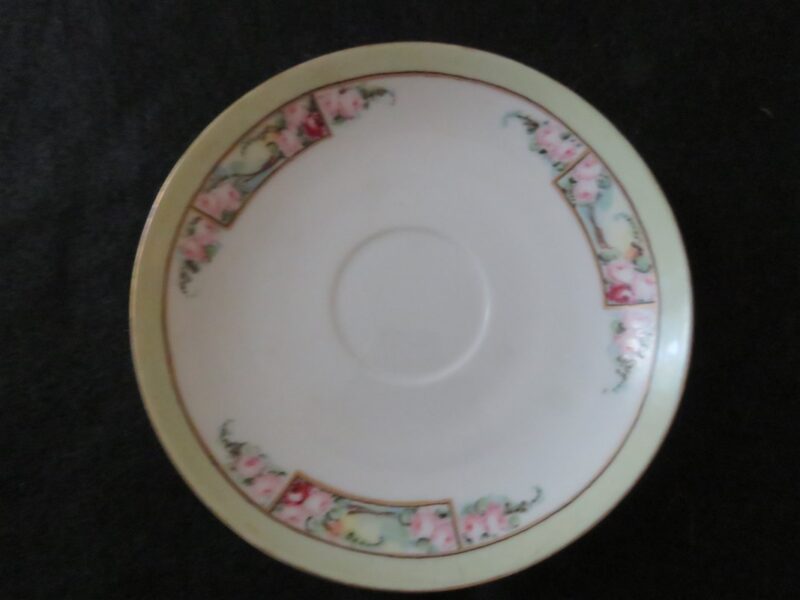 Saucer Royal Rudolstadt Prussia Signed by Mary Linderenburger Floral pattern. Green band on rim. Gold rings. 6 inch diameter. Very good condition. No chips or dings. These are vintage pieces and must be considered as used. 1