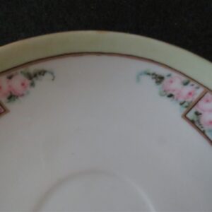 Saucer Royal Rudolstadt Prussia Signed by Mary Linderenburger Floral pattern. Green band on rim. Gold rings. 6 inch diameter. Very good condition. No chips or dings. These are vintage pieces and must be considered as used. 2