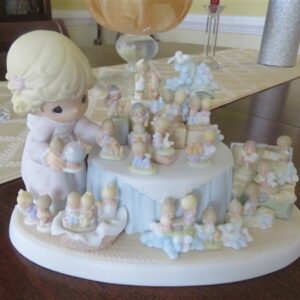 Precious Moments From the Beginning. Girl Displaying Favorite Original 21 Collectibles - Celebration of Precious Moments 25th anniversary. 2