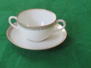 Flat Bouillon Cup & Saucer by Charles Ahrenfeldt. Made for the Cromwell And Hubbard of Cleveland One set of 4 cups and saucers. 2