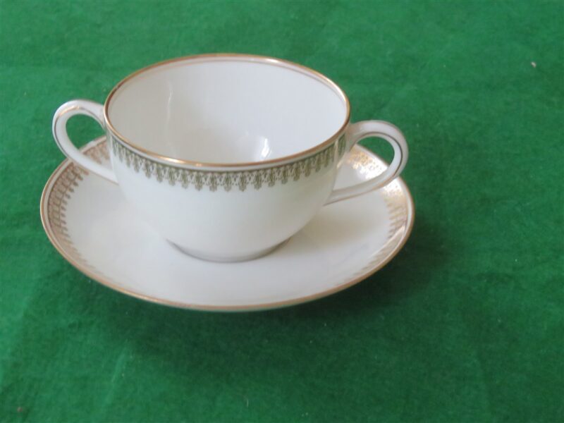 Flat Bouillon Cup & Saucer by Charles Ahrenfeldt. Made for the Cromwell And Hubbard of Cleveland One set of 4 cups and saucers. 2