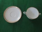 Flat Bouillon Cup & Saucer by Charles Ahrenfeldt. Made for the Cromwell And Hubbard of Cleveland One set of 4 cups and saucers. 3